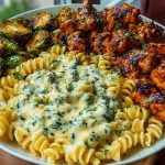 Hot Honey Cajun Chicken Alfredo with Basil Feta Swirl & Crispy Brussels Chips