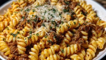 Cheesy Garlic Twisted Pasta with Cajun Ground Beef and Alfredo Velveeta